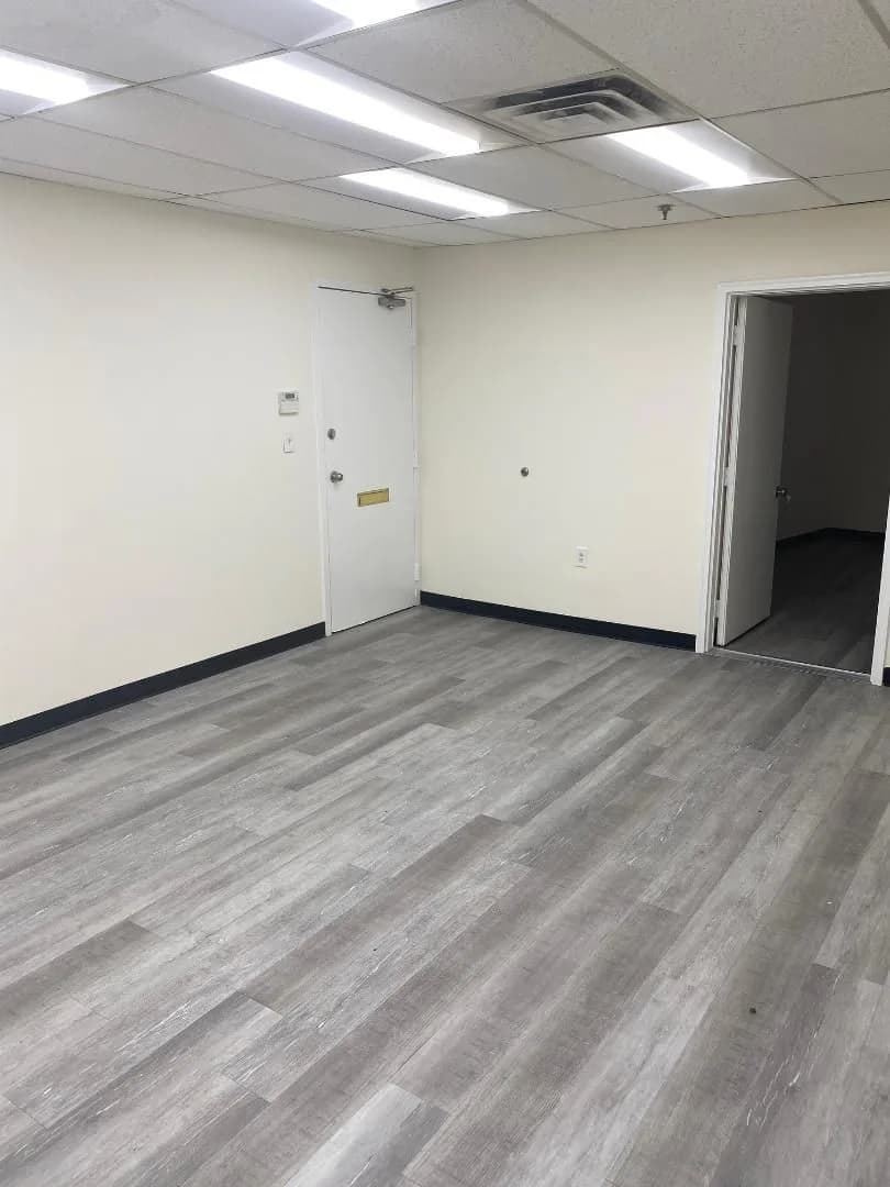 Soundproofed recording studio built by All Purpose Anytime Services, with new luxury vinyl plank flooring, painted walls and a suspended acoustic ceiling
